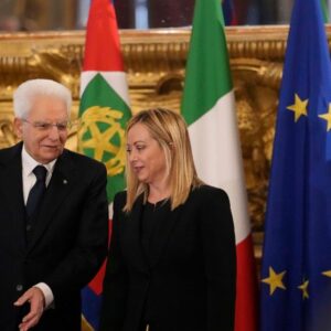 Italian President Sergio Mattarella is flanked by newly appointed Italian Premier Giorgia Meloni during the swearing in ceremony at Quirinal presidential palace in Rome, Saturday, Oct. 22, 2022, as Italy's first far-right-led government since the end
